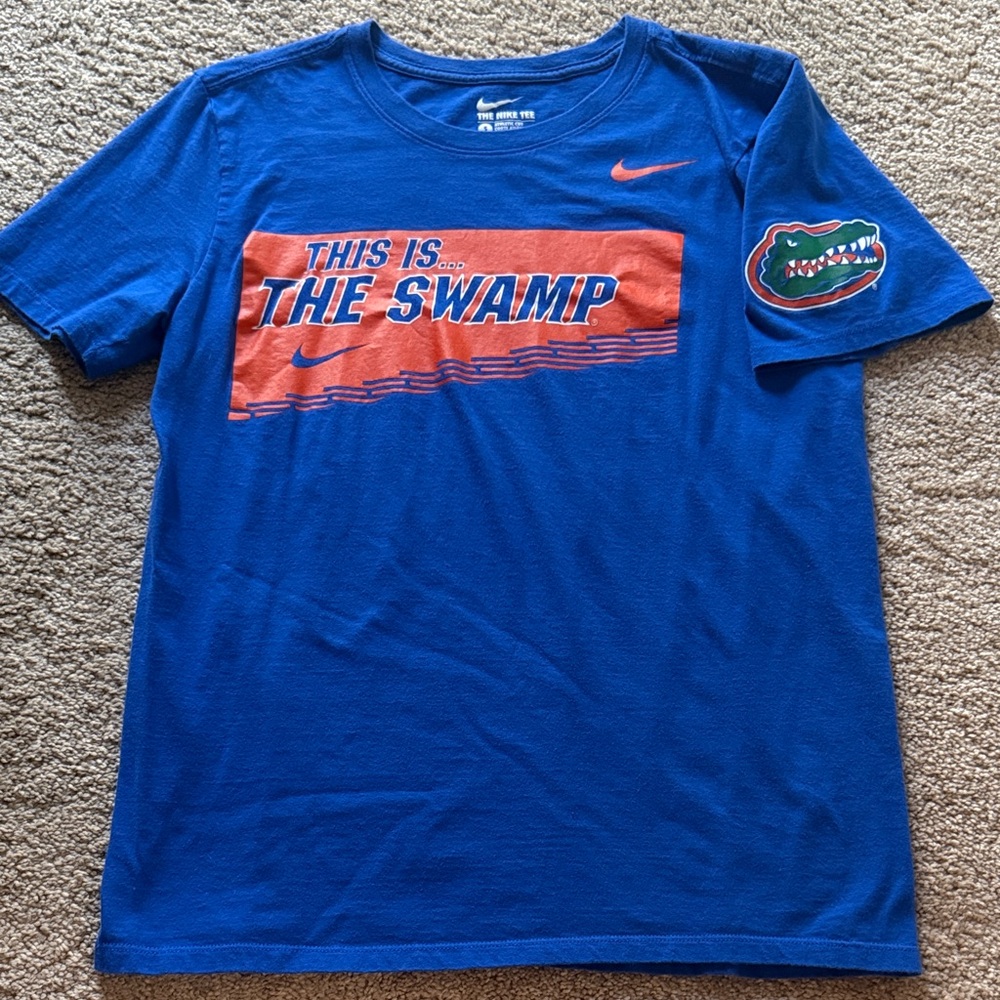 Nike Blue Tee with Orange 'This Is The Swamp' Graphic